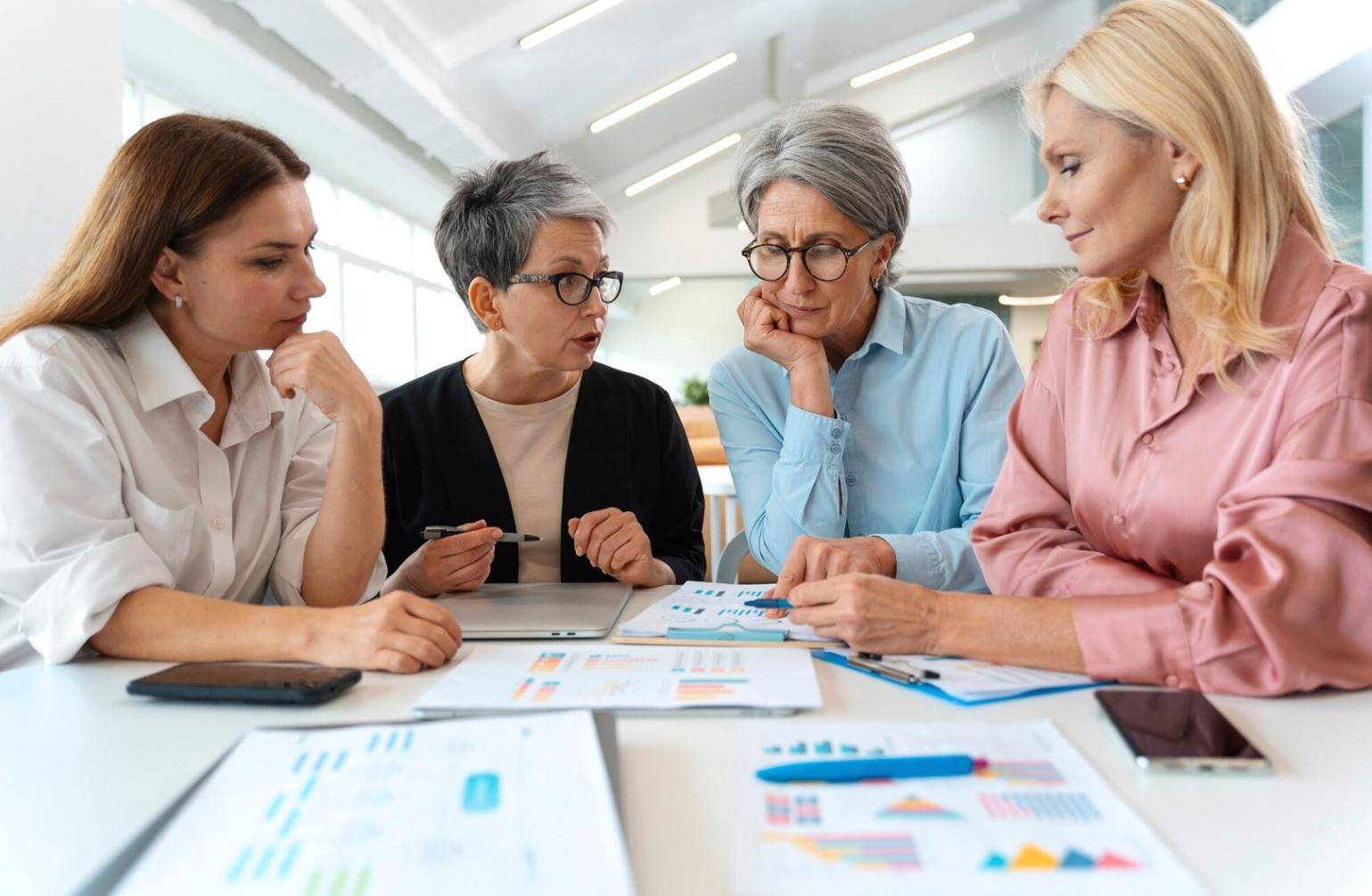 Financial advisor explaining investment concepts to clients using visual aids